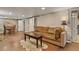 Finished basement featuring exposed brick, decorative rug, and comfortable seating area at 2716 N Vine St, Denver, CO 80205