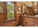 Bathroom featuring custom wood vanity, granite countertop, and lovely natural light at 2716 N Vine St, Denver, CO 80205