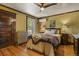 Stylish bedroom featuring hardwood floors, period trim, and vintage radiator at 2716 N Vine St, Denver, CO 80205