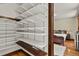 Spacious closet with built-in shelving and storage leading to bedroom at 2716 N Vine St, Denver, CO 80205
