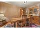Dining room featuring a large wooden table, chairs, and built-in cabinet at 2716 N Vine St, Denver, CO 80205