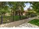 Charming two-story home with landscaped front yard and wrought iron fence at 2716 N Vine St, Denver, CO 80205