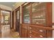 Classic hallway featuring hardwood floors, wood trim, and a built-in china cabinet at 2716 N Vine St, Denver, CO 80205