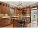 Spacious kitchen featuring wooden cabinets, granite countertops, and a center island at 2716 N Vine St, Denver, CO 80205