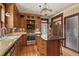 Charming kitchen featuring wood cabinets, stainless steel appliances, and an island at 2716 N Vine St, Denver, CO 80205
