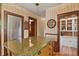 Bright kitchen showcasing a center island with granite countertop and wooden cabinetry at 2716 N Vine St, Denver, CO 80205