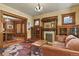 Elegant living room with hardwood floors, fireplace, and decorative stained glass windows at 2716 N Vine St, Denver, CO 80205