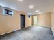 Spacious basement features neutral carpet, natural light and freshly painted walls at 4032 S Atchison Way, Aurora, CO 80014