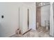 Stylish bathroom with a mirror-doored cabinet, neutral tiling, and a shower/tub combo at 4032 S Atchison Way, Aurora, CO 80014