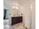Bathroom boasts double vanity, large mirror, and a closet for storage needs at 4032 S Atchison Way, Aurora, CO 80014