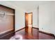 Bedroom featuring pristine hardwood floors and a neutral-colored closet at 4032 S Atchison Way, Aurora, CO 80014