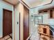 Kitchen with custom cabinets and adjacent hallway, showcasing seamless flow and access to the home's layout at 4032 S Atchison Way, Aurora, CO 80014