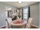 Inviting dining room features stylish decor and natural light, adjacent to living area, perfect for gatherings at 8160 Washington St # 67, Denver, CO 80229