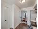 Hallway view with kitchen appliances and dining table at 8160 Washington St # 67, Denver, CO 80229