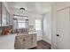 View of kitchen with stainless steel sink, light grey cabinets and hardwood floors at 8160 Washington St # 67, Denver, CO 80229