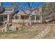 Backyard showcasing the property's exterior, with a patio area and views of the surrounding landscape at 8834 Blue Mountain Pl, Highlands Ranch, CO 80126