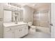 Bright bathroom featuring a single sink vanity and shower over bathtub at 8834 Blue Mountain Pl, Highlands Ranch, CO 80126