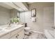 Bathroom featuring a vanity with large mirror and a shower over bathtub at 8834 Blue Mountain Pl, Highlands Ranch, CO 80126