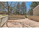Wooden deck offers an outdoor living space, perfect for entertaining and relaxing with tree views at 8834 Blue Mountain Pl, Highlands Ranch, CO 80126