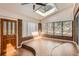 Bright sun room featuring large windows with outdoor views and a striking wood door at 8834 Blue Mountain Pl, Highlands Ranch, CO 80126