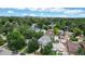 Neighborhood view showcasing a two-story house and surrounding homes at 2456 S Marion St, Denver, CO 80210