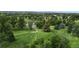 Aerial view of a golf course with players visible at 2456 S Marion St, Denver, CO 80210