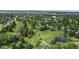 Aerial view of a park-like setting with a pond and walking paths at 2456 S Marion St, Denver, CO 80210