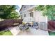 Private backyard patio with seating and a grill at 2456 S Marion St, Denver, CO 80210