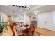 Bright dining area with wooden table and chairs, adjacent to kitchen at 2456 S Marion St, Denver, CO 80210