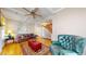 Living room with hardwood floors, comfortable seating, and a view of the staircase at 2456 S Marion St, Denver, CO 80210