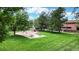 Community playground with swings and picnic tables at 2456 S Marion St, Denver, CO 80210