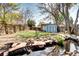 Tranquil backyard oasis with pond and landscaping, perfect for relaxation at 3336 N Saint Paul St, Denver, CO 80205