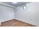 Simple basement with laminate flooring, a window for natural light, and neutral colors at 3336 N Saint Paul St, Denver, CO 80205