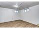 Finished basement offers flexible space with laminate flooring, natural light from windows, and neutral colors at 3336 N Saint Paul St, Denver, CO 80205