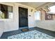 Inviting front porch with decorative rug and wreath, offering a warm welcome at 3336 N Saint Paul St, Denver, CO 80205