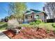 Charming brick home with landscaped front yard and mature trees, offering great curb appeal at 3336 N Saint Paul St, Denver, CO 80205
