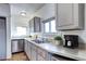 Clean kitchen features stainless steel appliances, white cabinets and ample counter space at 3336 N Saint Paul St, Denver, CO 80205