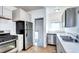 Efficient kitchen features stainless steel appliances, ample cabinet space, and easy access to the outdoors at 3336 N Saint Paul St, Denver, CO 80205