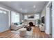 Cozy living room features a decorative fireplace, hardwood floors, and lots of natural light at 3336 N Saint Paul St, Denver, CO 80205