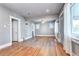 Living room boasts original hardwood floors, ceiling fan, and lots of natural light at 3336 N Saint Paul St, Denver, CO 80205