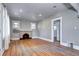 Open living room with hardwood floors, fireplace, neutral walls, and lots of natural light at 3336 N Saint Paul St, Denver, CO 80205