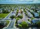 Wide aerial shot of the property in a leafy suburban neighborhood and nearby amenities at 1169 S Alton Ct, Denver, CO 80247