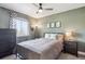 Cozy bedroom features a ceiling fan, neutral tones, and a comfortable full bed at 1169 S Alton Ct, Denver, CO 80247