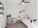 Charming bedroom with playful decor, a single bed, and ample space for toys at 1169 S Alton Ct, Denver, CO 80247