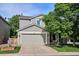 Charming gray two-story home featuring a two-car garage and well-maintained front yard at 1169 S Alton Ct, Denver, CO 80247