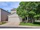 Charming gray two-story home featuring a two-car garage and well-maintained front yard at 1169 S Alton Ct, Denver, CO 80247