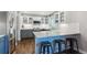 Modern kitchen with granite countertops, stainless steel appliances, and stylish bar seating at 1169 S Alton Ct, Denver, CO 80247