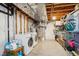 Laundry area with washer, dryer, and storage space in unfinished basement at 1169 S Alton Ct, Denver, CO 80247