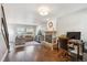 Spacious living room with hardwood floors, stone fireplace, and comfortable seating at 1169 S Alton Ct, Denver, CO 80247