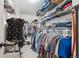 Spacious walk-in closet with ample shelving and hanging space for organized storage at 1169 S Alton Ct, Denver, CO 80247